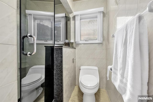 28 Elizabeth Ct, Secaucus, NJ 07094 - full bath featuring tile walls, toilet, tile patterned flooring, and a stall shower
