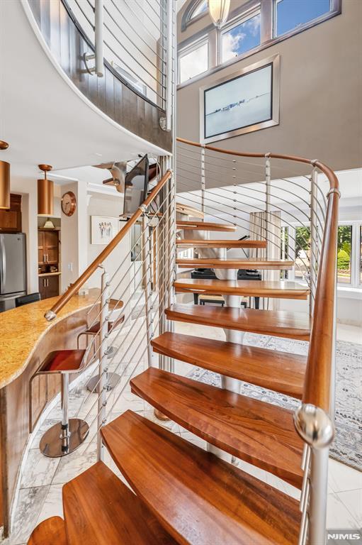 28 Elizabeth Ct, Secaucus, NJ 07094 - stairway featuring a high ceiling