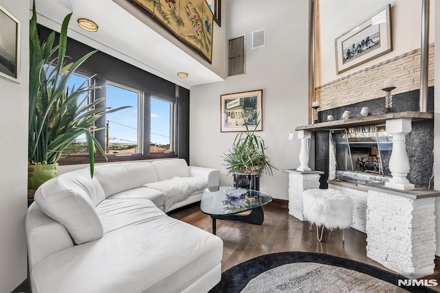 28 Elizabeth Ct, Secaucus, NJ 07094 - living area featuring hardwood / wood-style floors, a fireplace, and a high ceiling