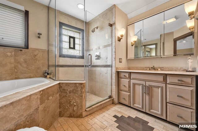 28 Elizabeth Ct, Secaucus, NJ 07094 - bathroom featuring a garden tub, vanity, and a stall shower