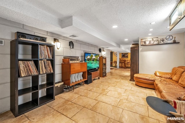 28 Elizabeth Ct, Secaucus, NJ 07094 - living area with stone tile floors, recessed lighting, and a textured ceiling