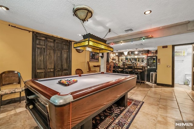28 Elizabeth Ct, Secaucus, NJ 07094 - playroom featuring billiards, a community bar, a textured ceiling, baseboards, and recessed lighting
