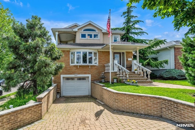 28 Elizabeth Ct, Secaucus, NJ 07094 - view of front of property featuring an attached garage, decorative driveway, and brick siding