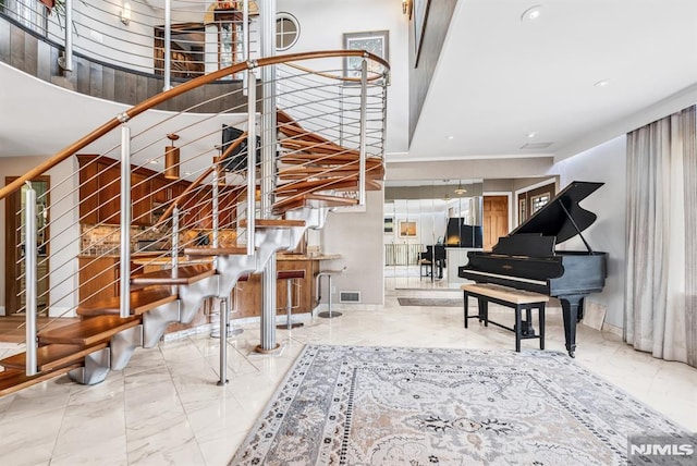 28 Elizabeth Ct, Secaucus, NJ 07094 - stairs with marble look tile flooring and recessed lighting