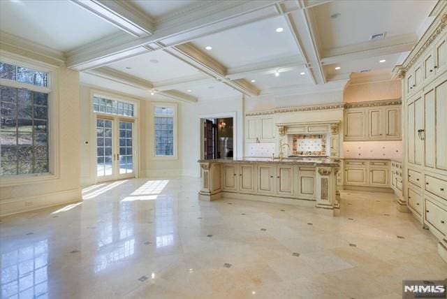11 Margo Way, Alpine, NJ 07620 - kitchen featuring beam ceiling, coffered ceiling, cream cabinetry, french doors, and a breakfast bar