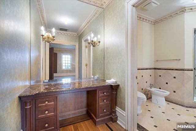 11 Margo Way, Alpine, NJ 07620 - bathroom featuring crown molding, a bidet, vanity, a wainscoted wall, and wood finished floors