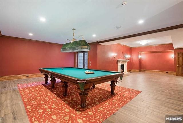 11 Margo Way, Alpine, NJ 07620 - rec room featuring billiards table, crown molding, wood finished floors, a fireplace, and recessed lighting