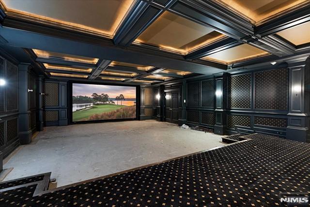 11 Margo Way, Alpine, NJ 07620 - home theater room featuring a decorative wall, coffered ceiling, carpet floors, ornate columns, and beam ceiling