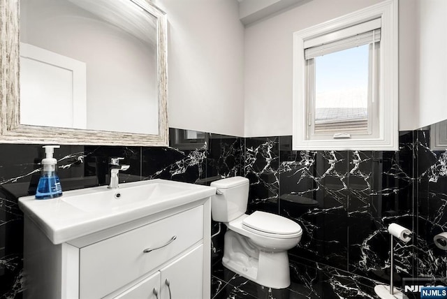 805 Fairview Ln, Fort Lee, NJ 07024 - bathroom with vanity, toilet, and tasteful backsplash