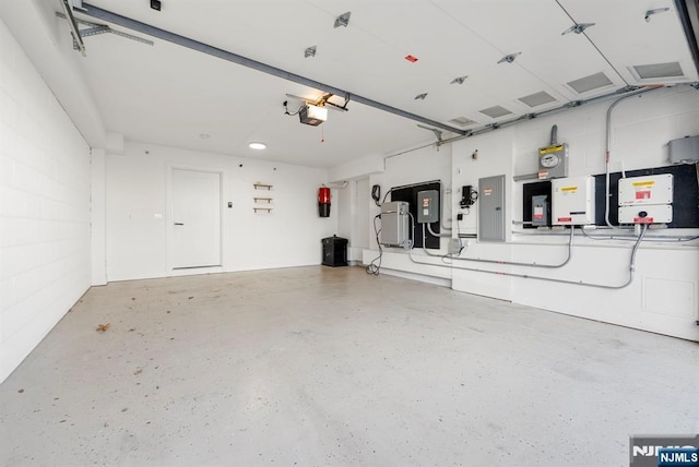 805 Fairview Ln, Fort Lee, NJ 07024 - garage featuring electric panel, a central vacuum unit, and a garage door opener
