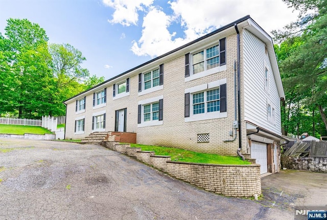 72 Francisco Ave, Little Falls, NJ 07424 - colonial house with driveway, brick siding, and an attached garage