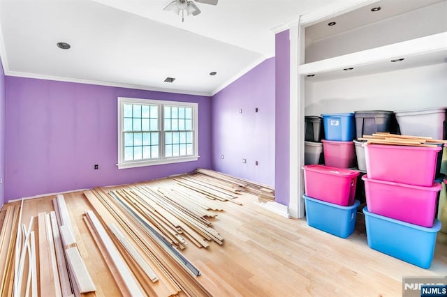 72 Francisco Ave, Little Falls, NJ 07424 - unfurnished living room with crown molding, a ceiling fan, lofted ceiling, wood finished floors, and recessed lighting