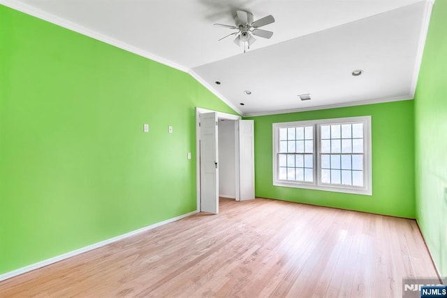 72 Francisco Ave, Little Falls, NJ 07424 - empty room with a ceiling fan, vaulted ceiling, crown molding, wood finished floors, and baseboards