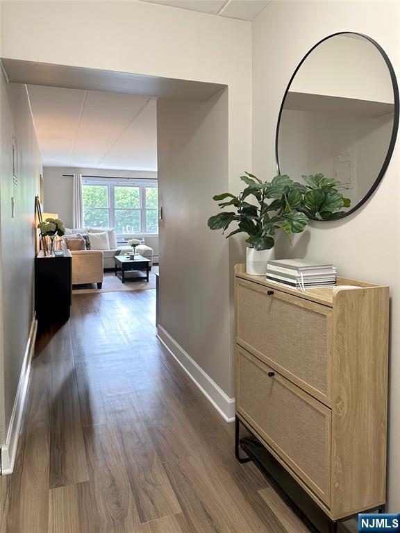 25 Jefferson St Unit 6E, Hackensack, NJ 07601 - hall with dark wood finished floors and baseboards