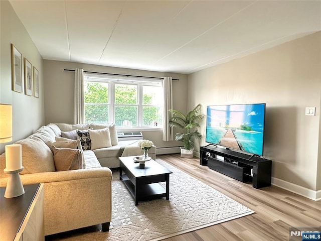25 Jefferson St Unit 6E, Hackensack, NJ 07601 - living room featuring baseboards, wood finished floors, and a baseboard heating unit