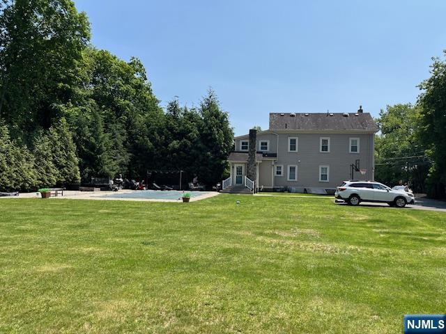 889 Circle Ave, Franklin Lakes, NJ 07417 - view of community with a yard and entry steps