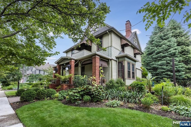 33 Ramapo Ave, Pompton Lakes, NJ 07442 - view of side of home featuring a chimney and a lawn