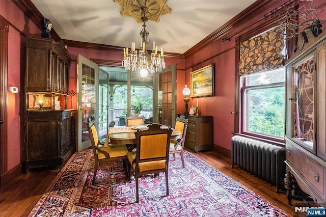 33 Ramapo Ave, Pompton Lakes, NJ 07442 - dining space with radiator, a chandelier, wood finished floors, and crown molding