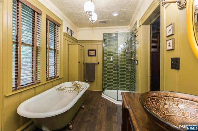 33 Ramapo Ave, Pompton Lakes, NJ 07442 - full bath with wood-type flooring, an ornate ceiling, a shower stall, a soaking tub, and a baseboard radiator