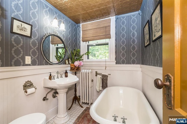 33 Ramapo Ave, Pompton Lakes, NJ 07442 - full bathroom featuring a soaking tub, radiator heating unit, wallpapered walls, an ornate ceiling, and a wainscoted wall