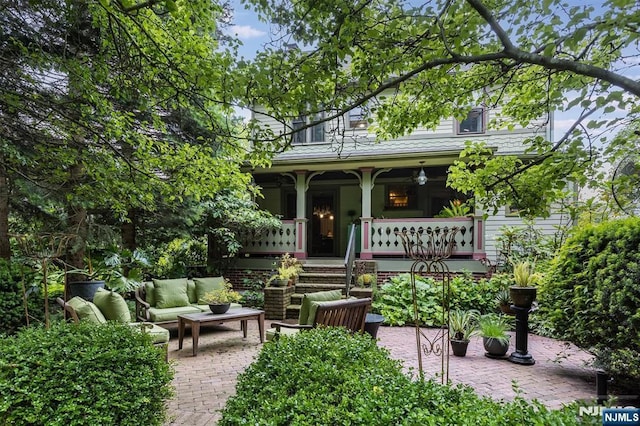 33 Ramapo Ave, Pompton Lakes, NJ 07442 - view of front of home featuring a porch, an outdoor hangout area, and a patio
