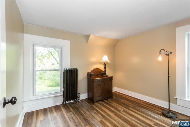 33 Ramapo Ave, Pompton Lakes, NJ 07442 - spare room with radiator, dark wood-type flooring, and baseboards