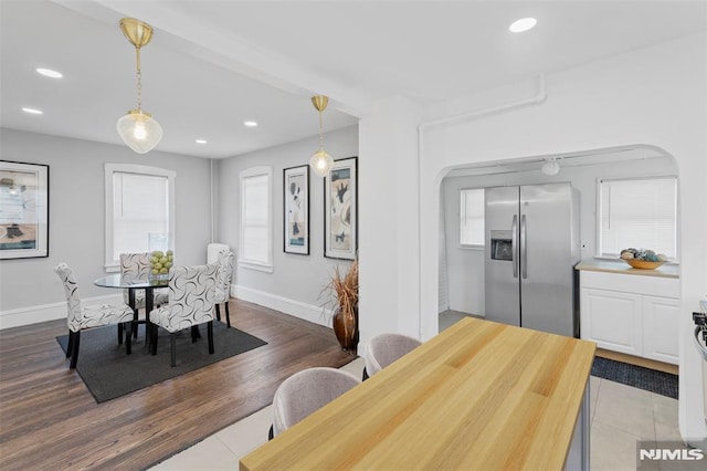 1146 Stasia St, Teaneck, NJ 07666 - dining area with arched walkways, recessed lighting, and tile patterned flooring