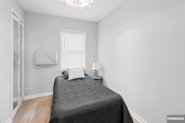 1146 Stasia St, Teaneck, NJ 07666 - bedroom with wood finished floors and baseboards
