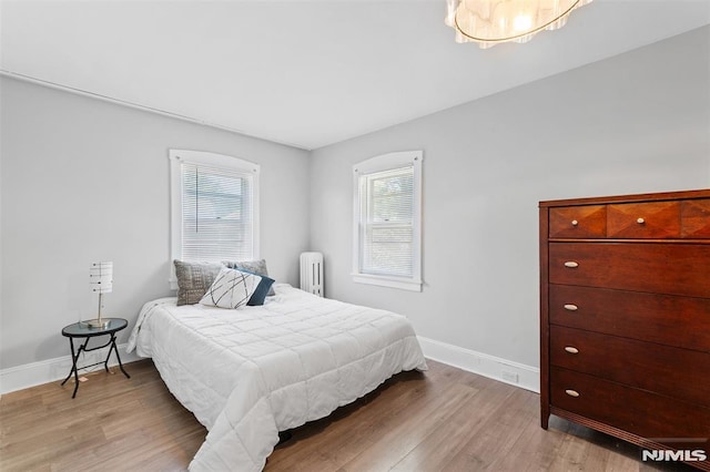 1146 Stasia St, Teaneck, NJ 07666 - bedroom featuring radiator and wood finished floors