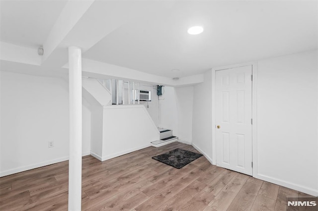 1146 Stasia St, Teaneck, NJ 07666 - finished below grade area featuring wood finished floors and a wall unit AC