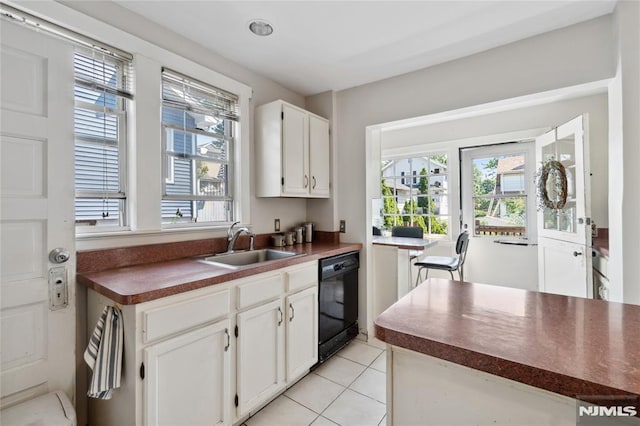 42 Oakwood Ave, Bogota, NJ 07603 - kitchen featuring black dishwasher, dark countertops, a sink, and plenty of natural light