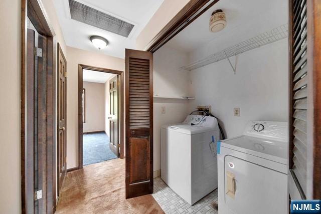 23 Bohnert Pl, Waldwick, NJ 07463 - laundry room with washer and dryer and light carpet