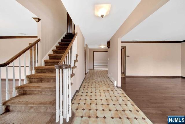 23 Bohnert Pl, Waldwick, NJ 07463 - staircase featuring baseboards and wood finished floors