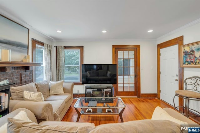 179 State St, Bloomfield, NJ 07003 - living area featuring ornamental molding, wood finished floors, a fireplace, baseboards, and recessed lighting