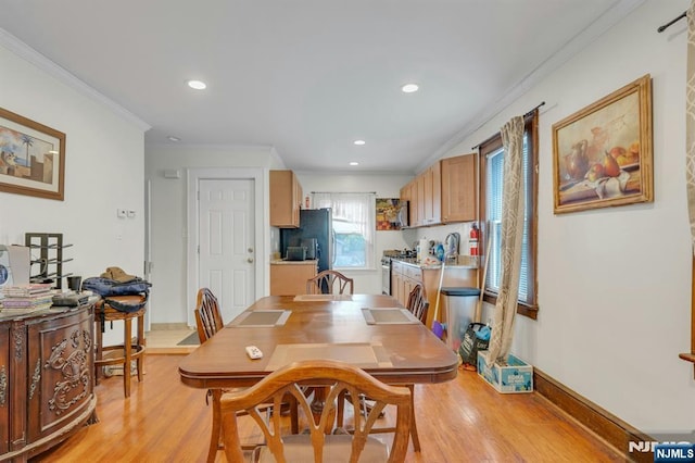 179 State St, Bloomfield, NJ 07003 - dining area with crown molding, light wood finished floors, recessed lighting, and baseboards