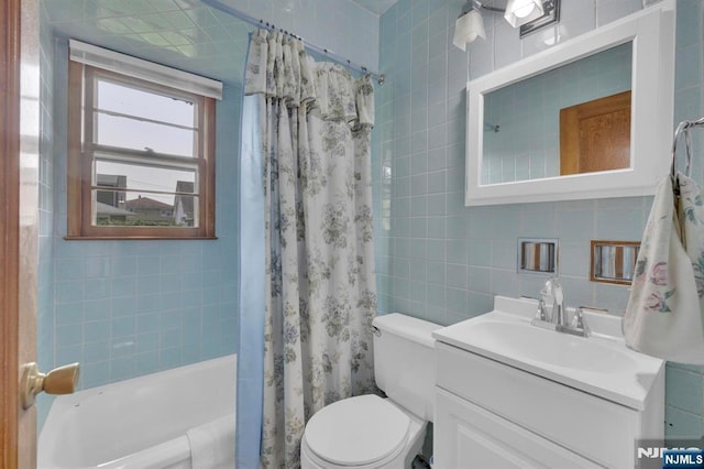 13 Wonham St, Clifton, NJ 07013 - bathroom with tile walls, toilet, vanity, and shower / bath combo with shower curtain