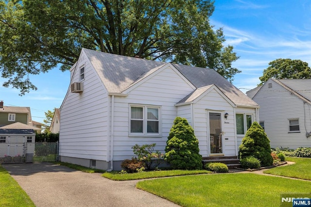 13 Wonham St, Clifton, NJ 07013 - bungalow-style house with asphalt driveway, cooling unit, and roof with shingles
