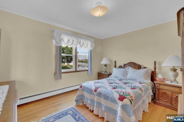 13 Wonham St, Clifton, NJ 07013 - bedroom with a baseboard heating unit, wood finished floors, and ornamental molding