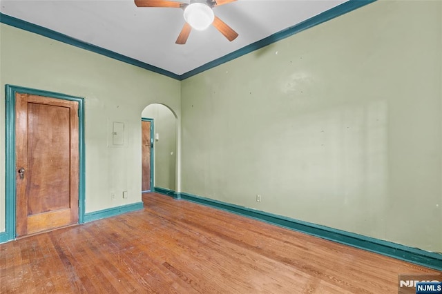 300 2nd St Unit 2, Jersey City, NJ 07302 - unfurnished room with arched walkways, wood finished floors, ceiling fan, crown molding, and baseboards