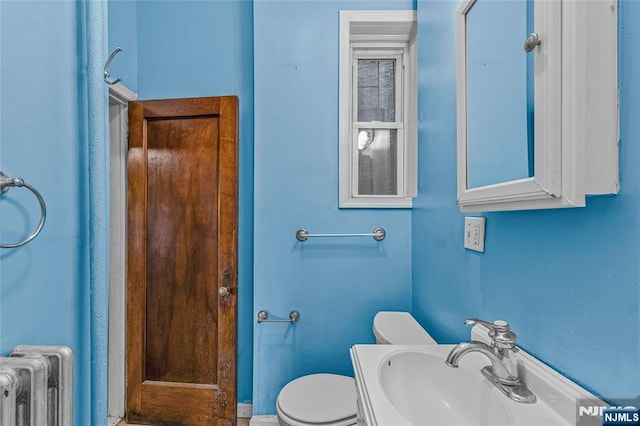 300 2nd St Unit 2, Jersey City, NJ 07302 - half bath with radiator, a sink, and toilet
