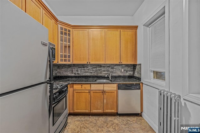 300 2nd St Unit 2, Jersey City, NJ 07302 - kitchen featuring stainless steel appliances, radiator heating unit, tasteful backsplash, and a sink