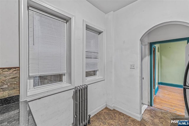 300 2nd St Unit 2, Jersey City, NJ 07302 - corridor featuring radiator, baseboards, and arched walkways