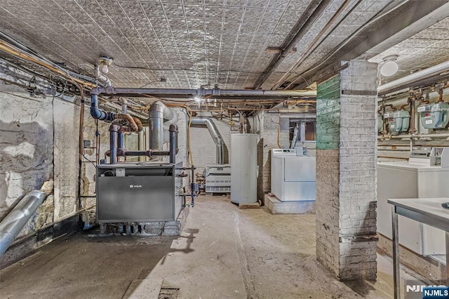 300 2nd St Unit 2, Jersey City, NJ 07302 - unfinished basement featuring water heater, independent washer and dryer, a heating unit, and gas meter