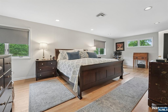 13 Stonewall Dr, Livingston, NJ 07039 - bedroom featuring multiple windows, baseboards, wood finished floors, and recessed lighting