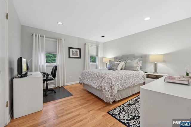 13 Stonewall Dr, Livingston, NJ 07039 - bedroom with light wood finished floors, an office area, recessed lighting, and baseboards