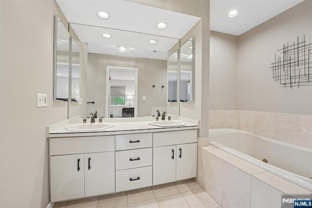 13 Stonewall Dr, Livingston, NJ 07039 - full bathroom with double vanity, a whirlpool tub, recessed lighting, and tile patterned floors