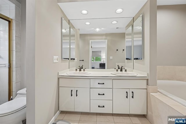 13 Stonewall Dr, Livingston, NJ 07039 - full bathroom with double vanity, a bath, tile patterned floors, toilet, and recessed lighting