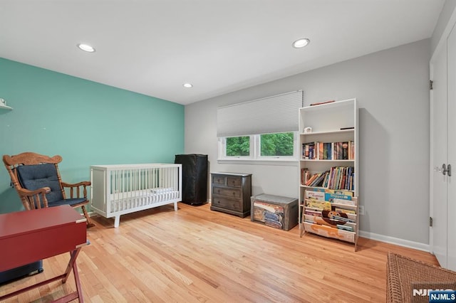 13 Stonewall Dr, Livingston, NJ 07039 - bedroom with wood finished floors, recessed lighting, baseboards, and a nursery area