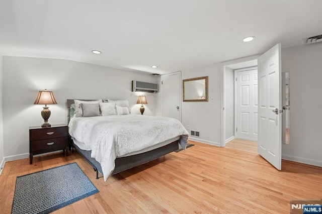 13 Stonewall Dr, Livingston, NJ 07039 - bedroom featuring baseboards, a wall mounted AC, light wood-style floors, and recessed lighting
