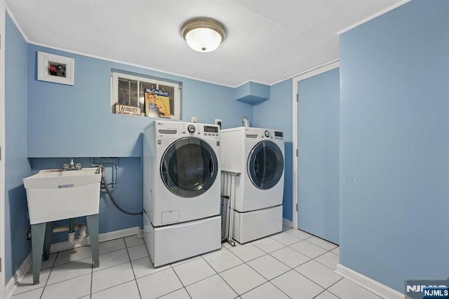 13 Stonewall Dr, Livingston, NJ 07039 - laundry room with washing machine and clothes dryer, baseboards, and light tile patterned floors